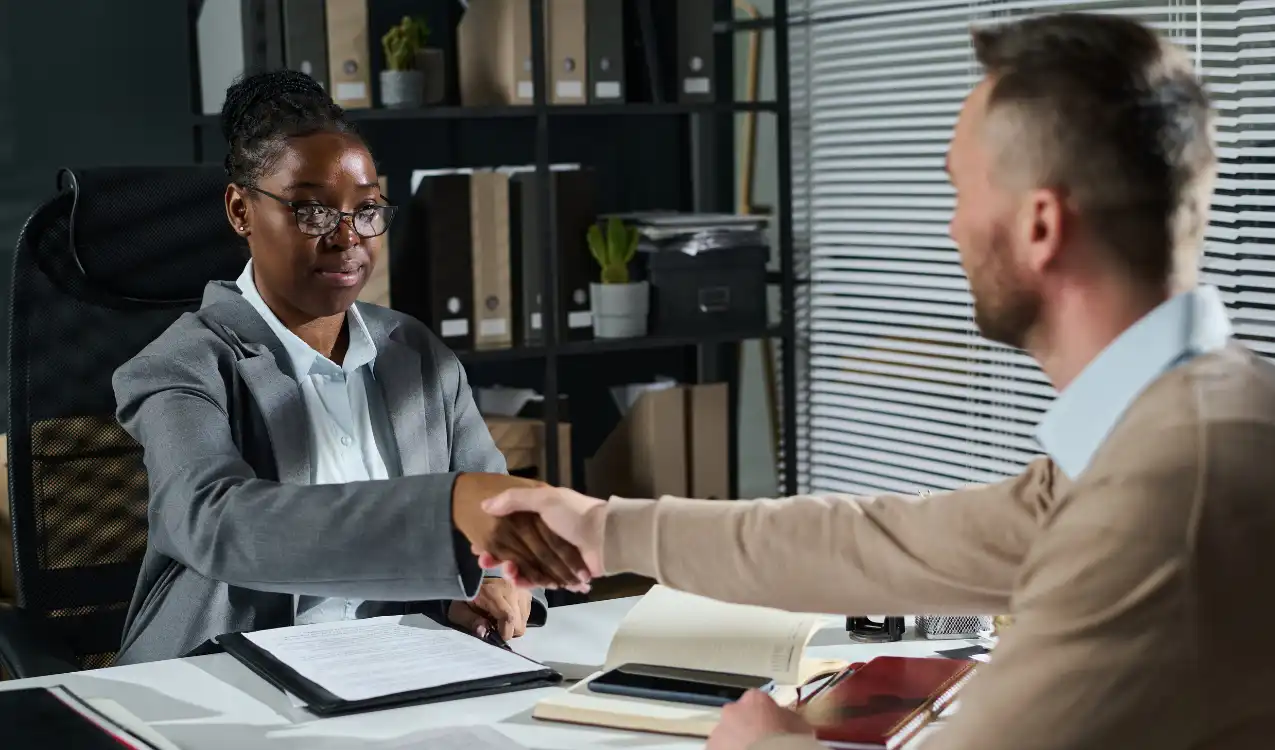 Solicitor explaining binding auction contract obligations to property buyer in the UK