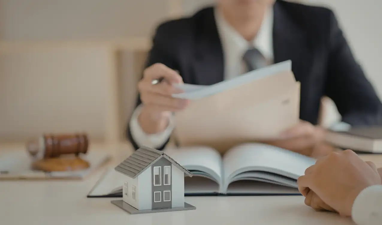 Auction conveyancing solicitor reviewing title deeds and legal documents for property purchase