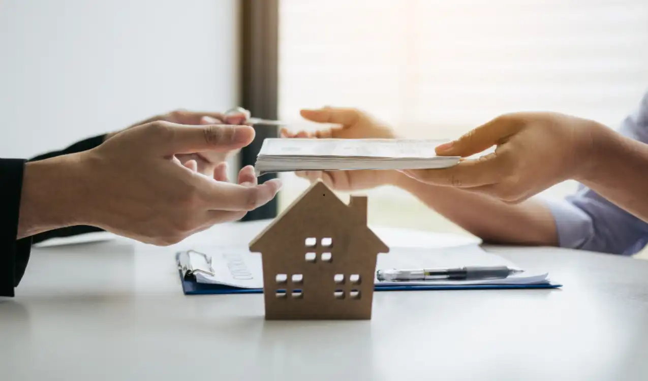 Auction solicitor explaining memorandum of sale and auction legal pack to property buyer