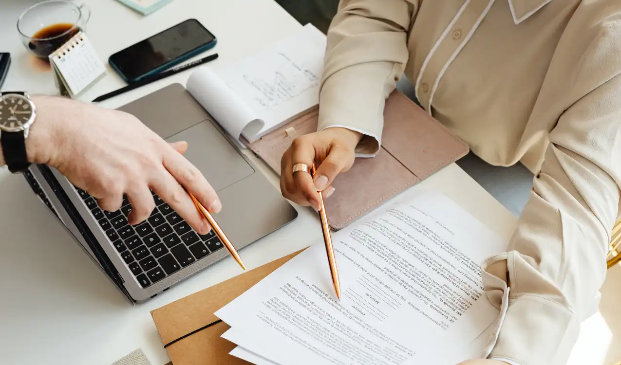 Solicitor reviewing property searches auction legal pack before bidding