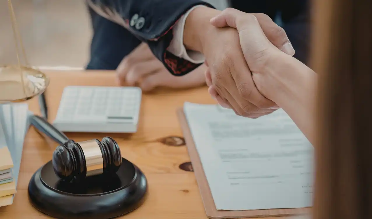 Solicitor reviewing auction buyer costs and special conditions of sale in legal pack before bidding on UK property