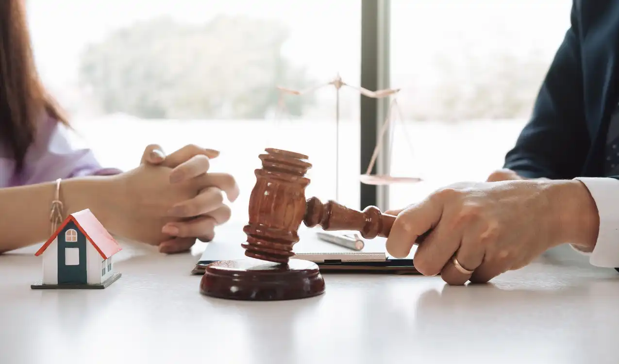 Auction gavel and mortgage approval documents showing the auction completion deadline pressure for buyers — mortgage for auction property