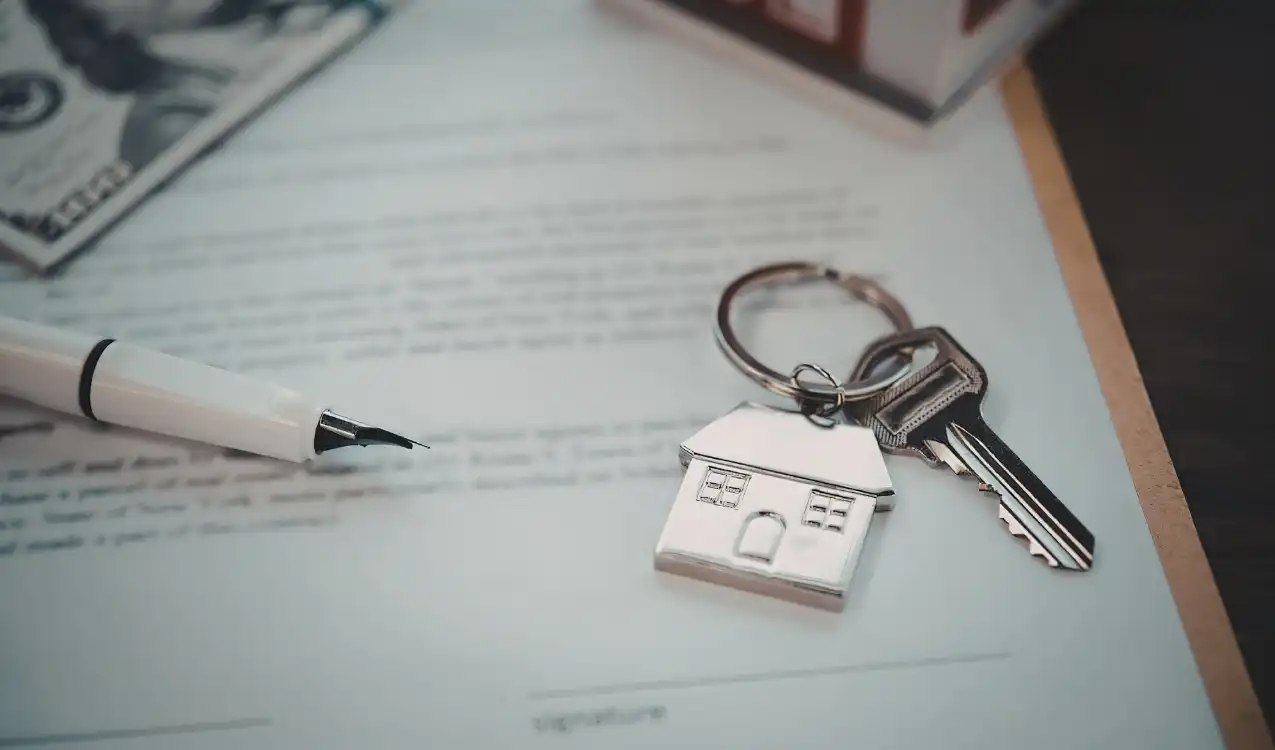 Solicitor examining auction legal pack leasehold documents including lease terms and service charge details