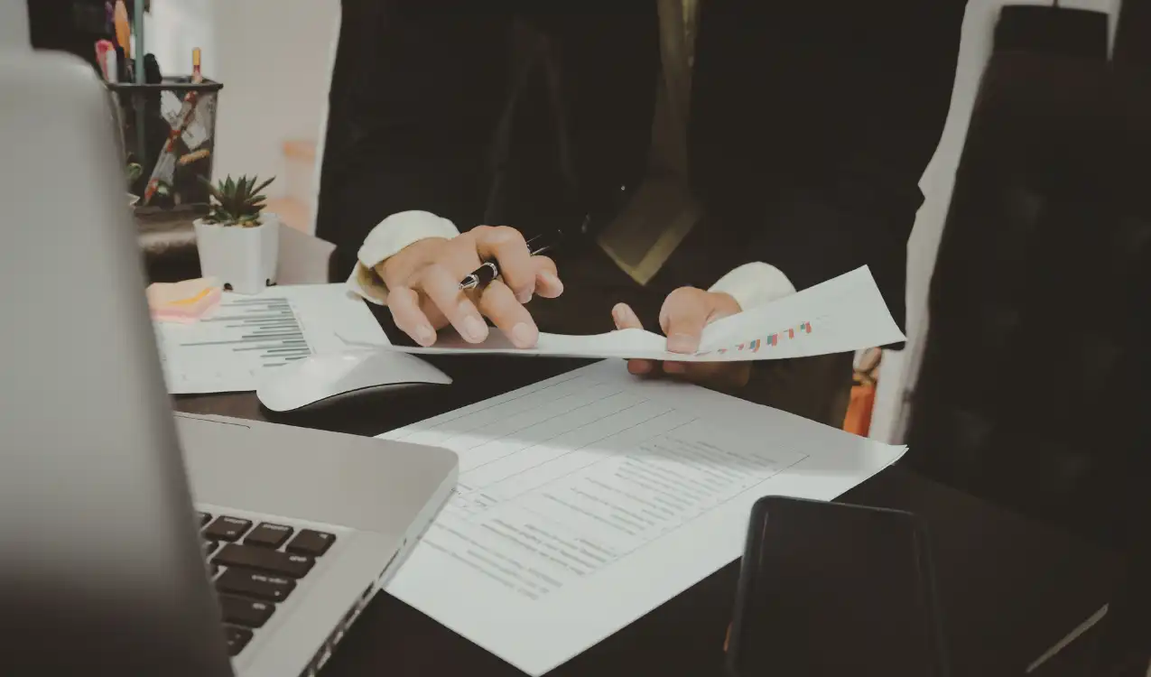 Solicitor reviewing auction legal pack documents before buyer bids on UK property — auction conveyancing
