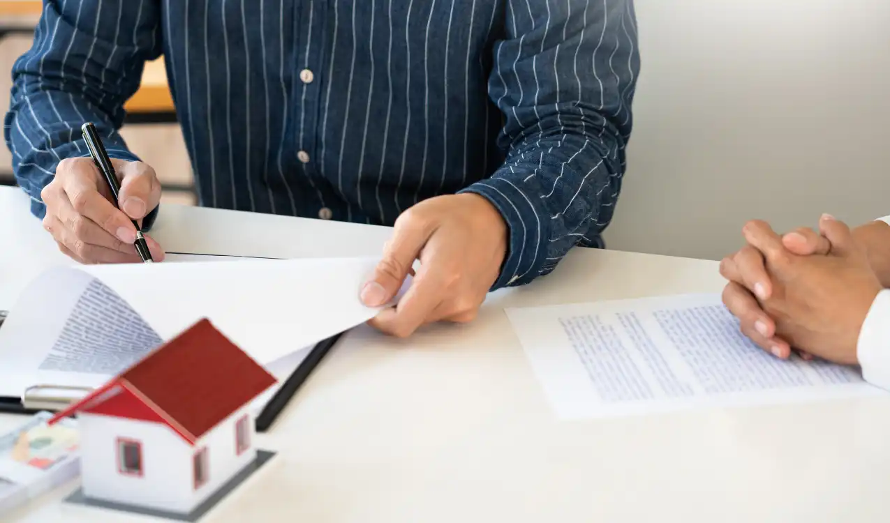 Solicitor and surveyor reviewing an auction legal pack review alongside property survey findings