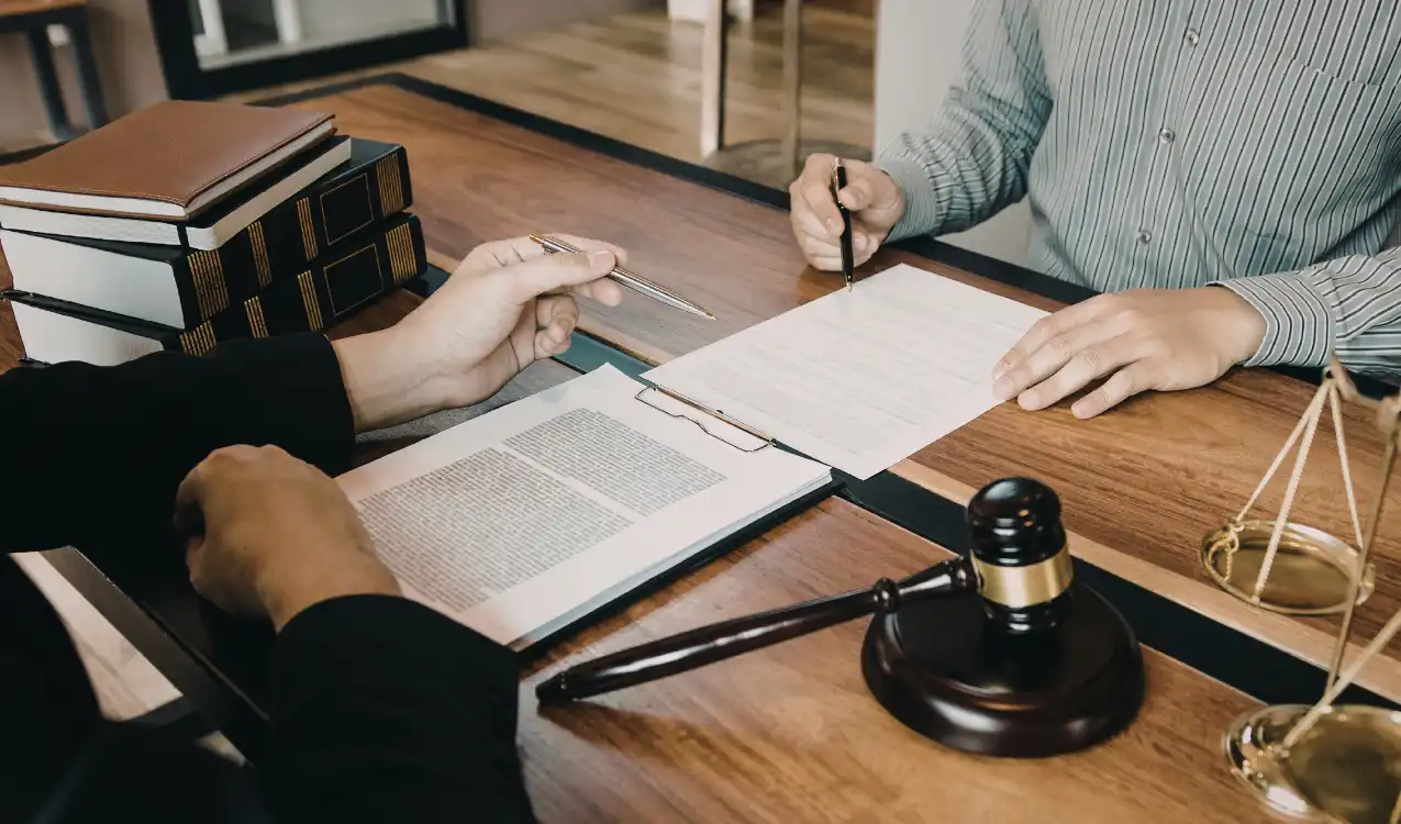 Buy a house at auction — auction property costs breakdown with solicitor reviewing legal pack
