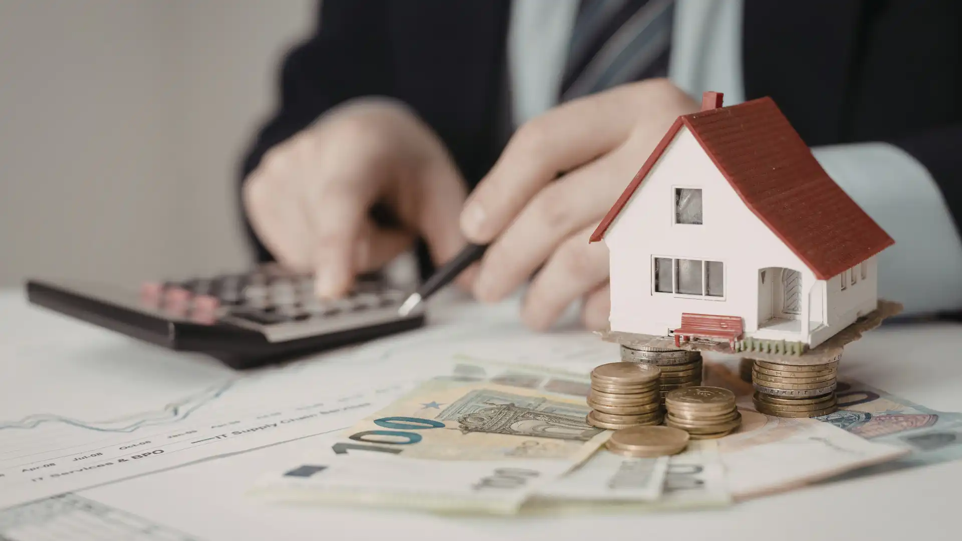 Auction seller fees breakdown — auctioneer reviewing property auction costs with seller