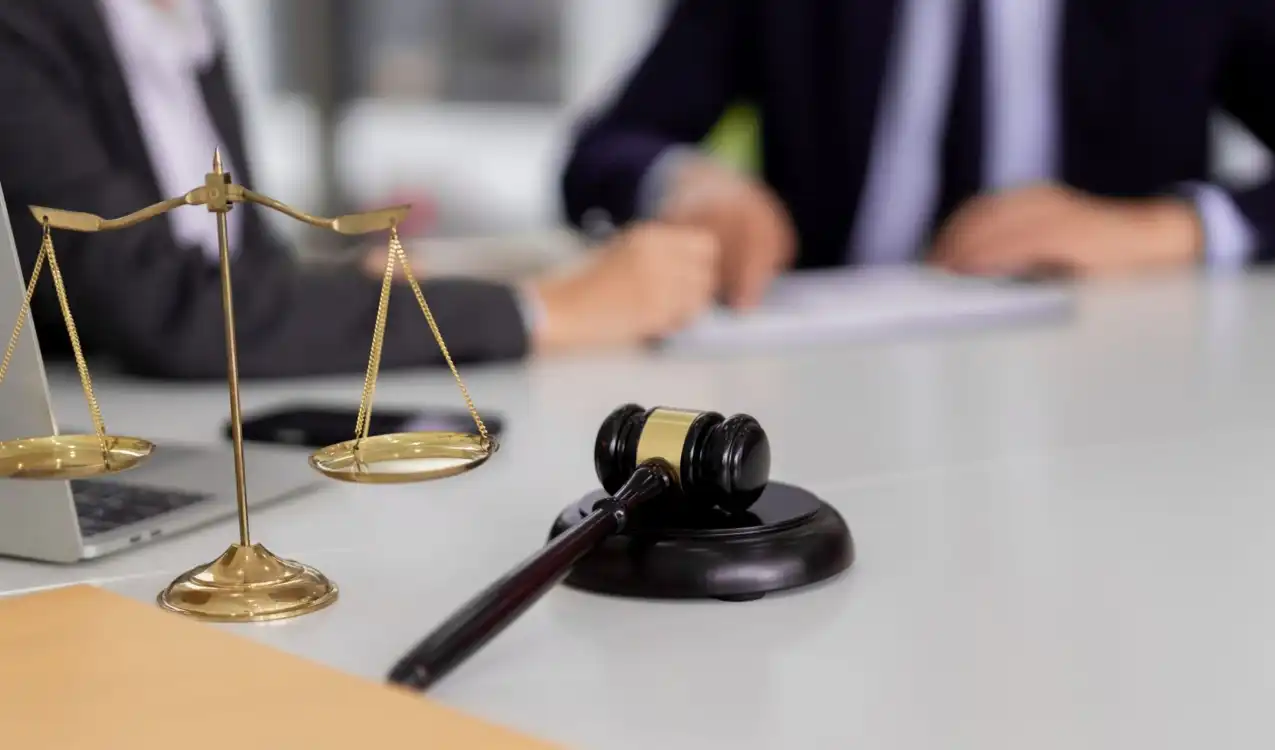Buy a house at auction — bidders raising paddles at UK property auction